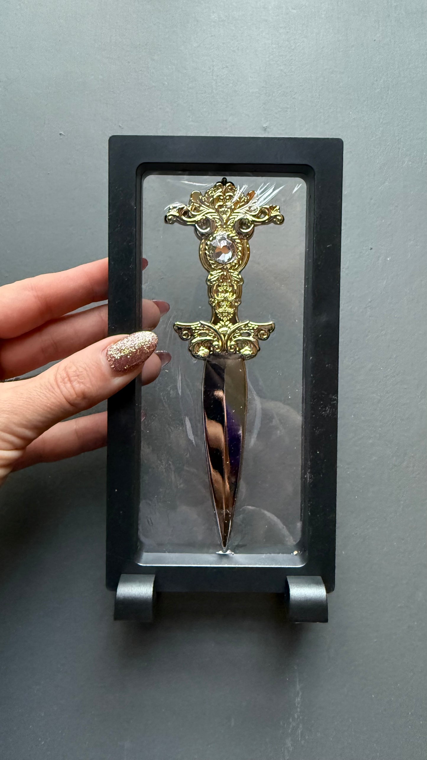 The Sorceress bookshelf display dagger