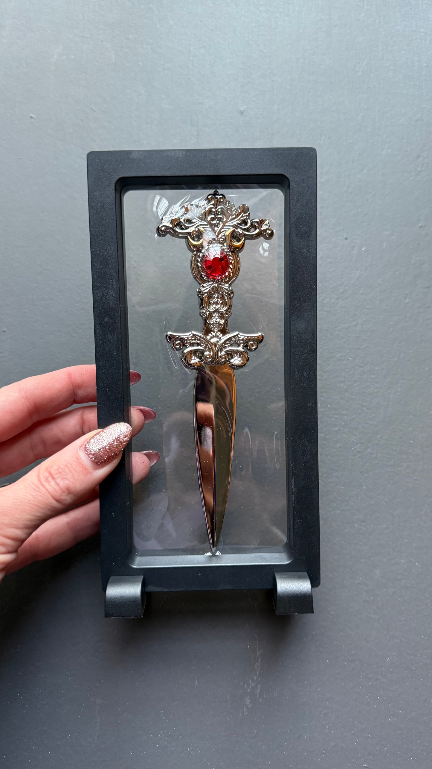The Sorceress bookshelf display dagger