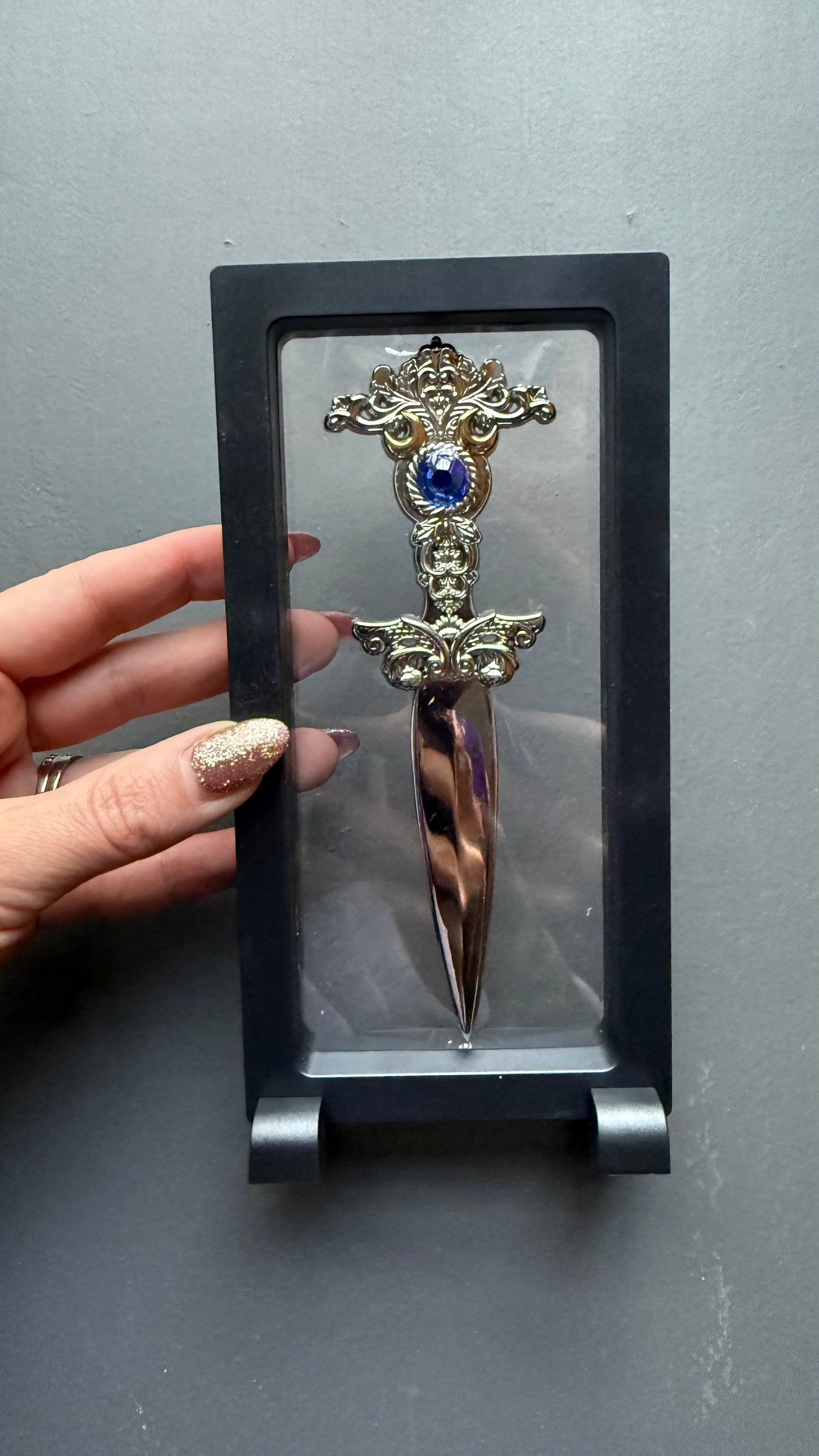 The Sorceress bookshelf display dagger