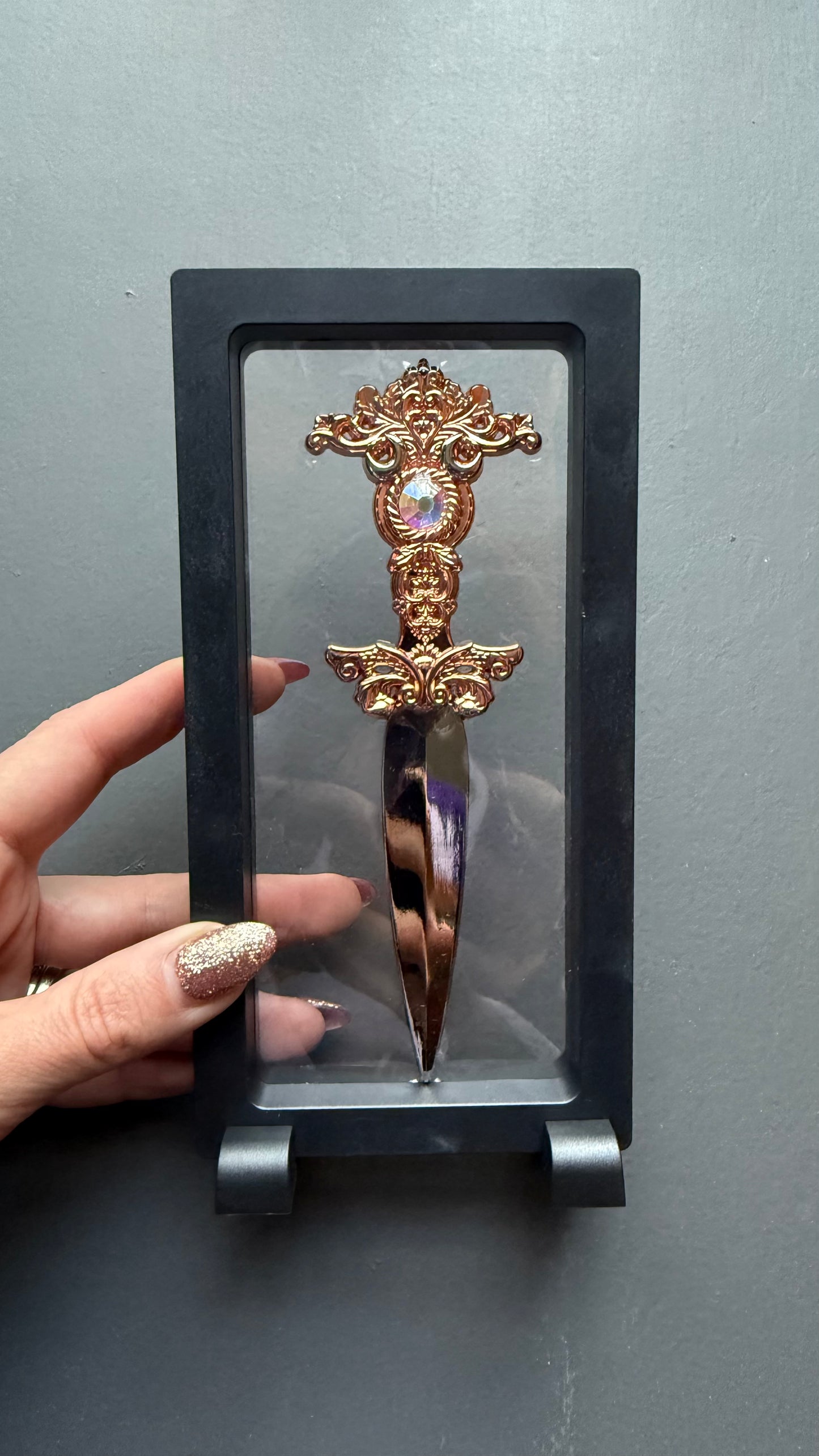 The Sorceress bookshelf display dagger