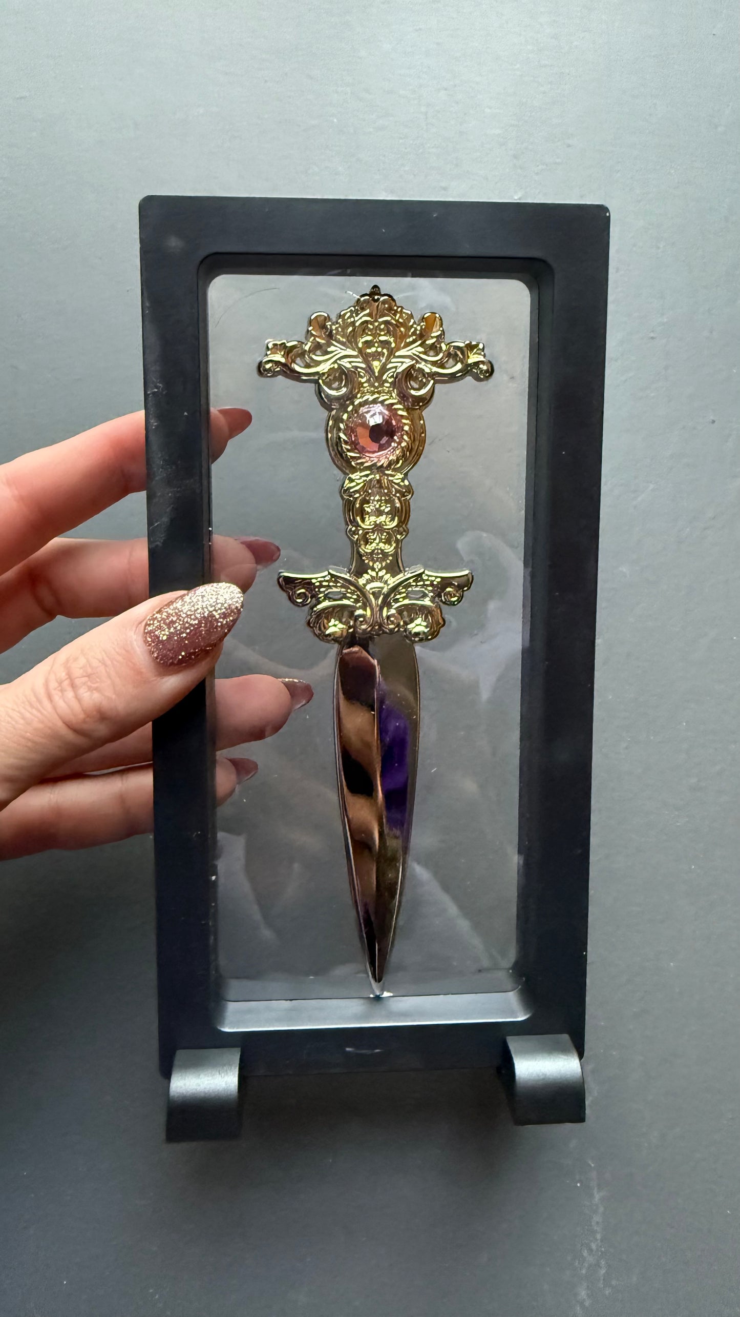 The Sorceress bookshelf display dagger