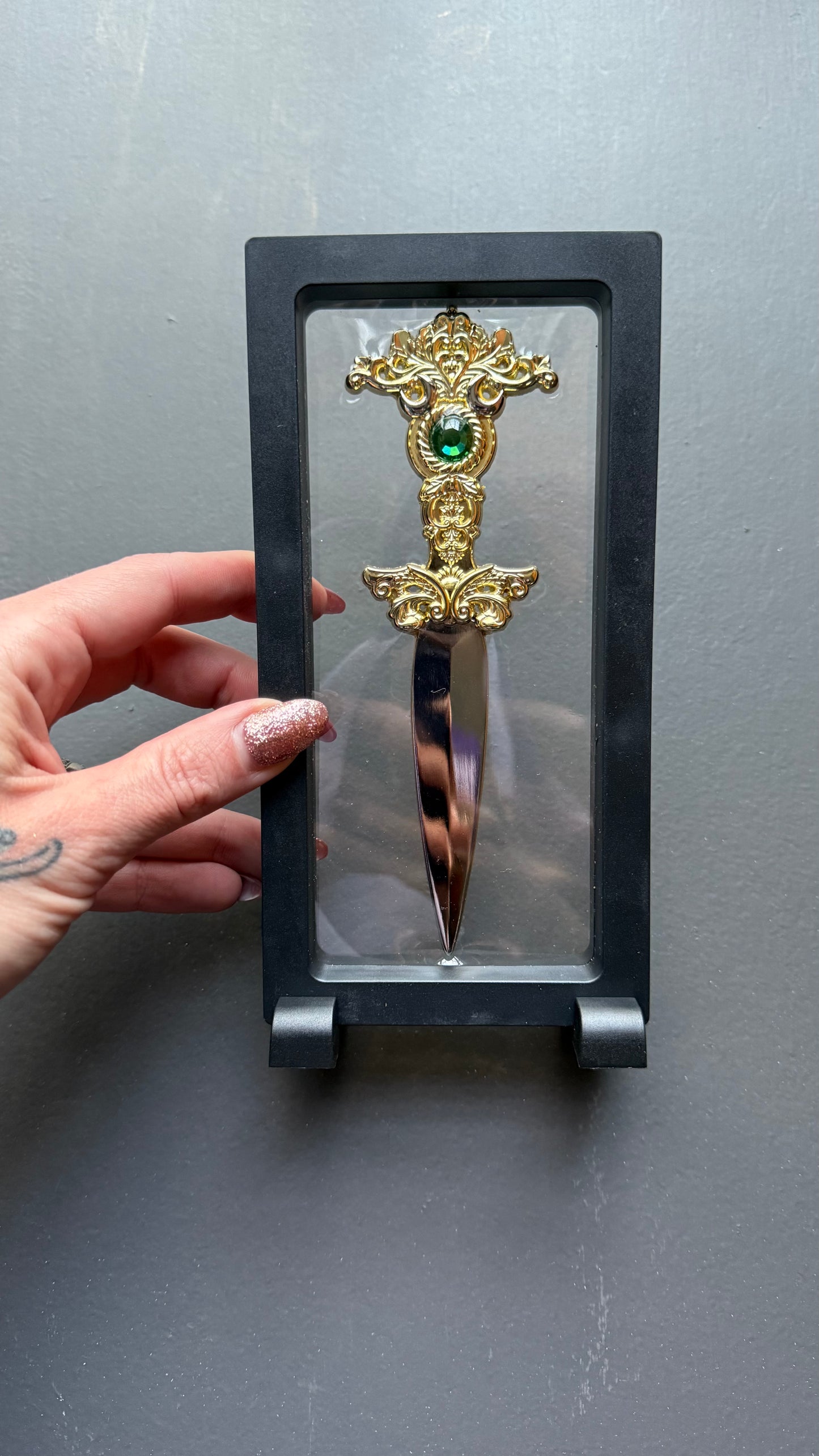 The Sorceress bookshelf display dagger