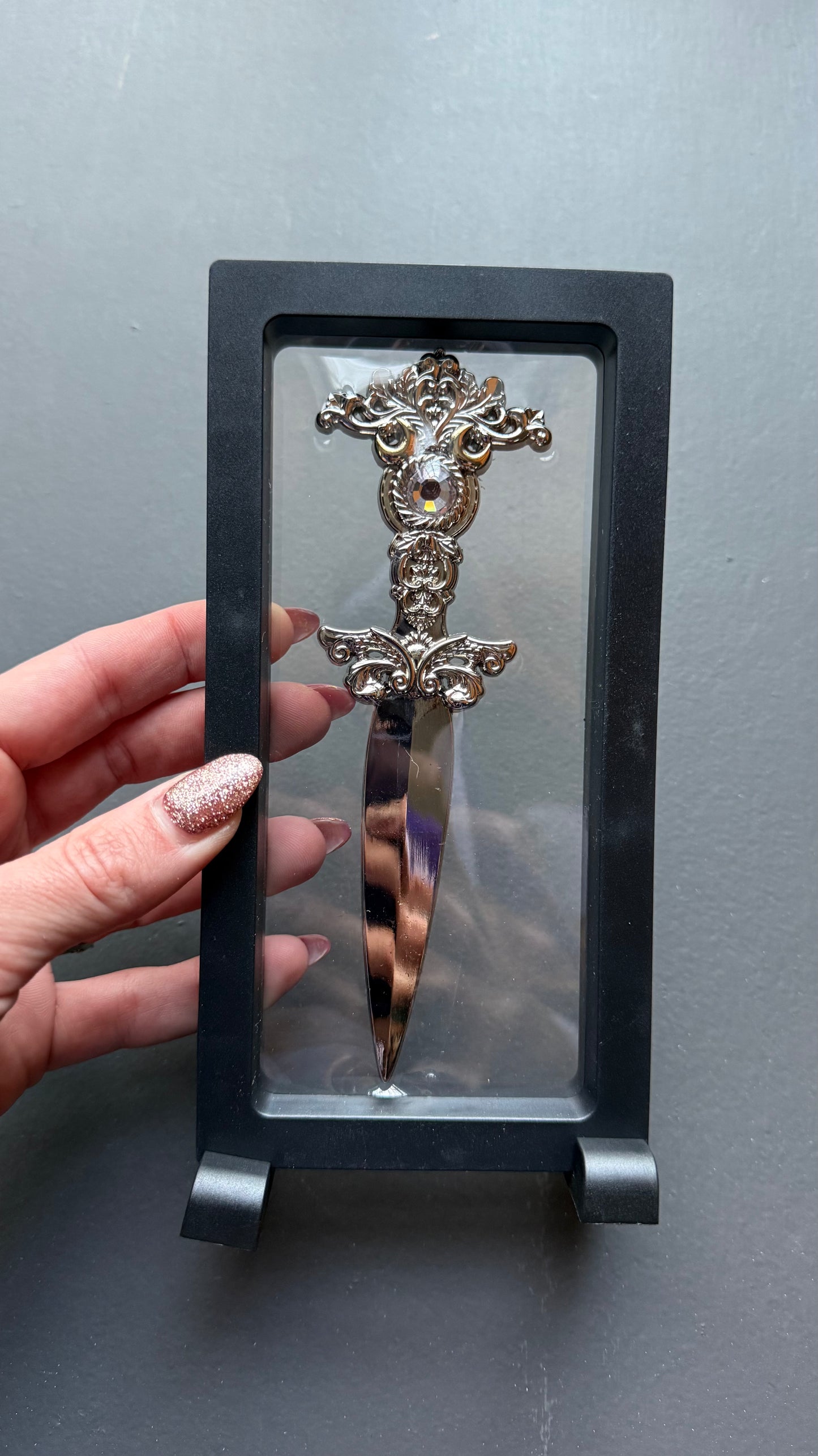 The Sorceress bookshelf display dagger