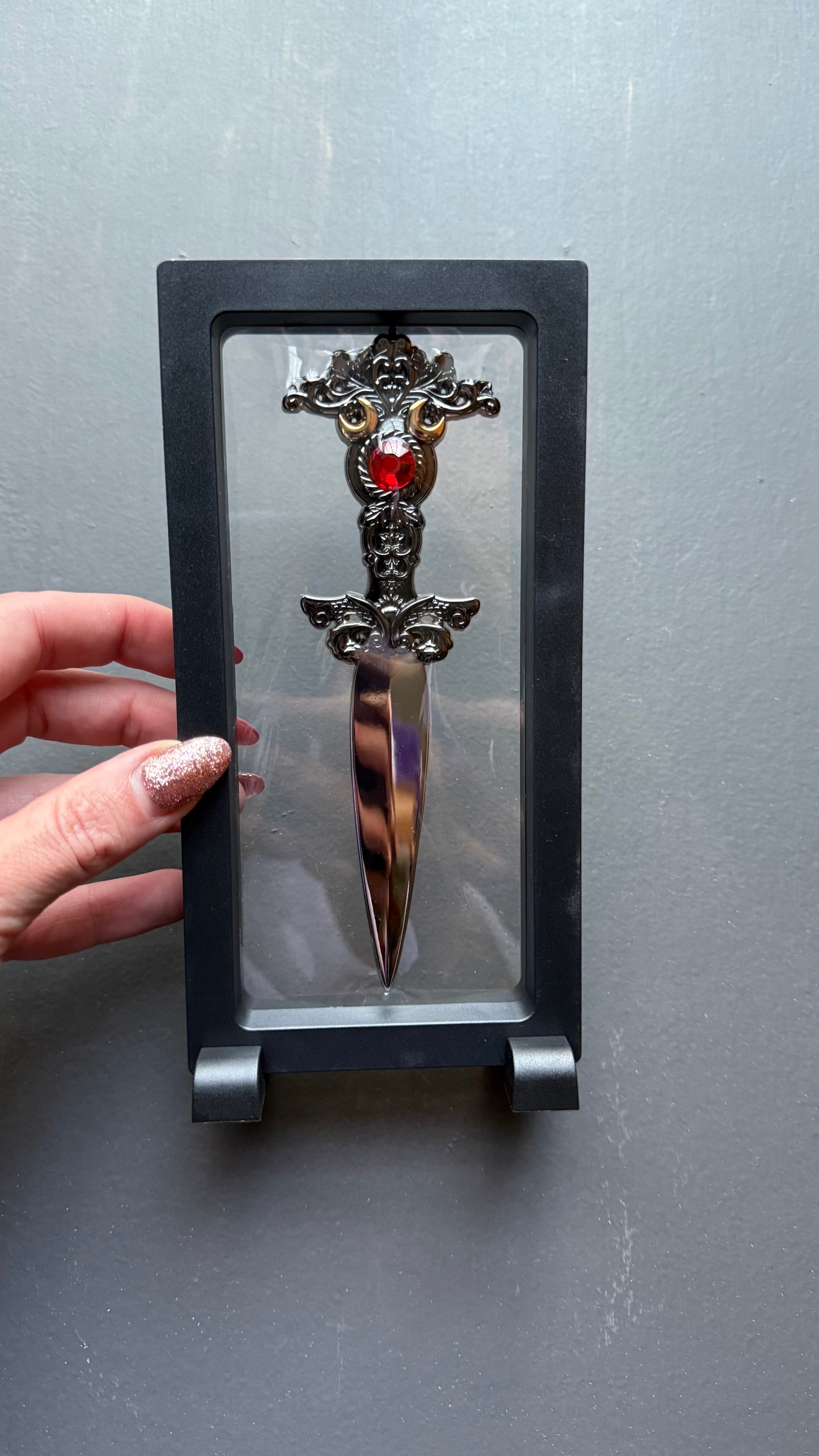 The Sorceress bookshelf display dagger