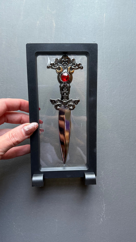 The Sorceress bookshelf display dagger