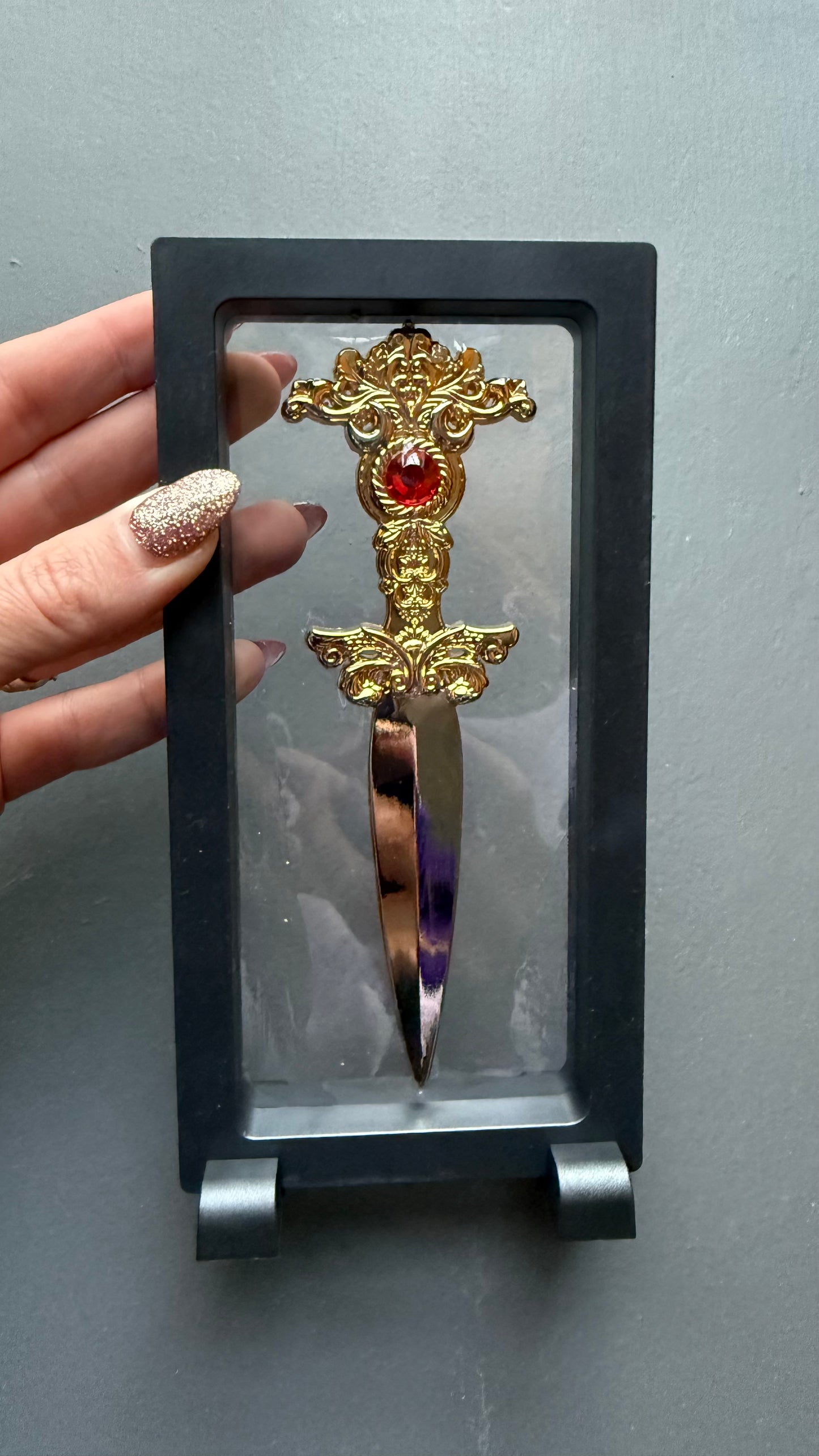 The Sorceress bookshelf display dagger