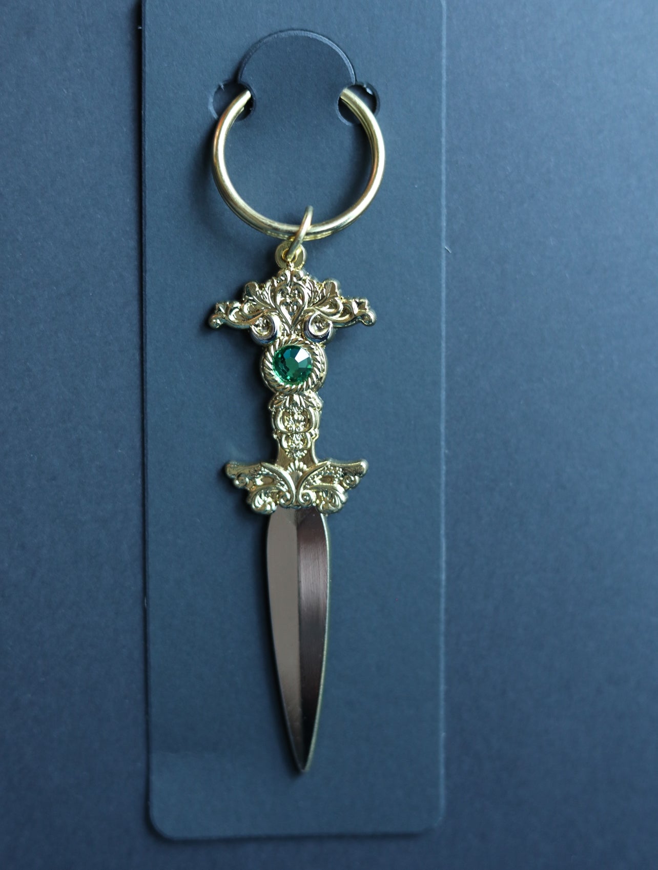 The Sorceress brass keychain